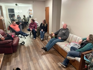 Church members talking together in a home